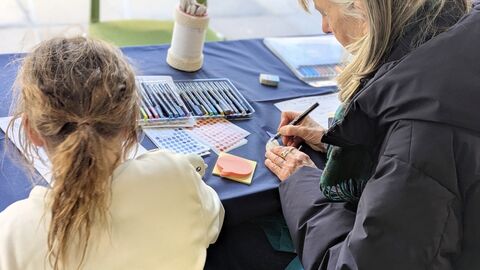 Photo of two people completing workshop based activities
