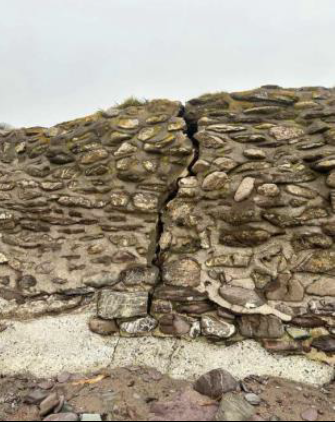 Wembury Beach Wall with large crack down middle as a result of storm damage